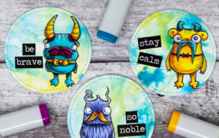 Copic marker coloured ATC coin inspiration & video featuring the Stampotique Originals Smitten Moustache Monsters stamp.