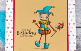 Coloured pencil coloured card inspiration & video featuring the Stamping Bella Oddball Fairytale Court Jester stamp, Fairytale Sentiment rubber stamp set & Polychromos pencils.