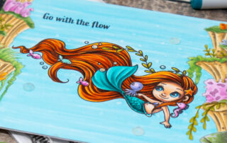 Copic marker coloured underwater mermaid scene featuring the Go With The Flow clear stamp set from Sweet November Stamps. YouTube members video.