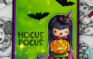 Copic marker coloured card and Copic colouring video featuring a halloween Miss Anya stamp from the Miss Anya All Year stamp kit.