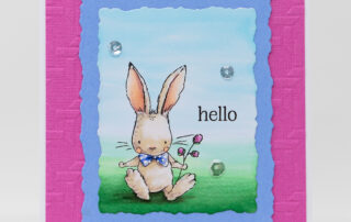 Handmade card inspiration & Copic colouring video featuring Spellbinders February 2025 Club of the Month Spring Smiles clear stamp & die kit.