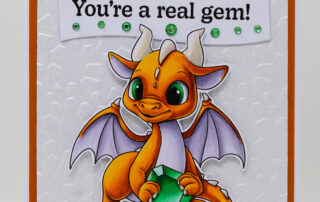 Card inspiration and colouring video featuring Sweet November Stamps May Emerald Dragon clear stamp set, coloured using Copic markers.