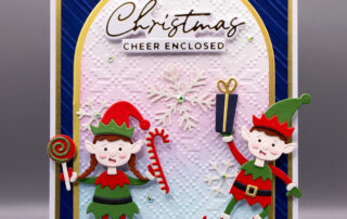 Handmade Christmas card inspiration featuring Spellbinders Simon Hurley North Pole Friends Santa's Elves die set.