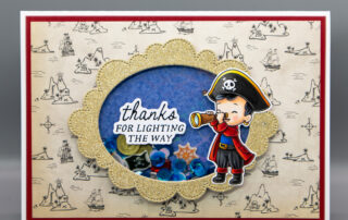 Handmade shaker card inspiration featuring Sweet November Stamps A Wee Bit of Piracy clear stamp set coloured using Copic markers.