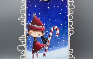 Christmas tag inspiration featuring Stamping Bella Whimsabella Christmas Elf Hollybelle rubber stamp coloured using Copic markers.